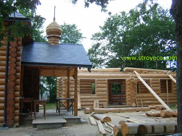  Montage of Parish wooden house in France. Photo 2